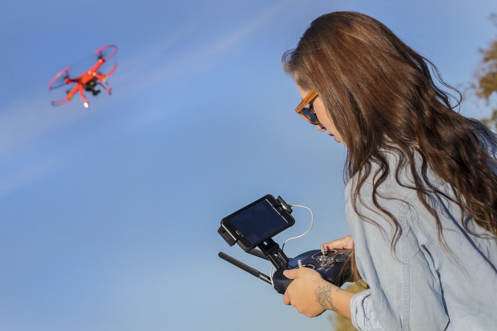 Young-woman-operates-video-drone